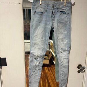 Light blue skinny jeans with ripped details